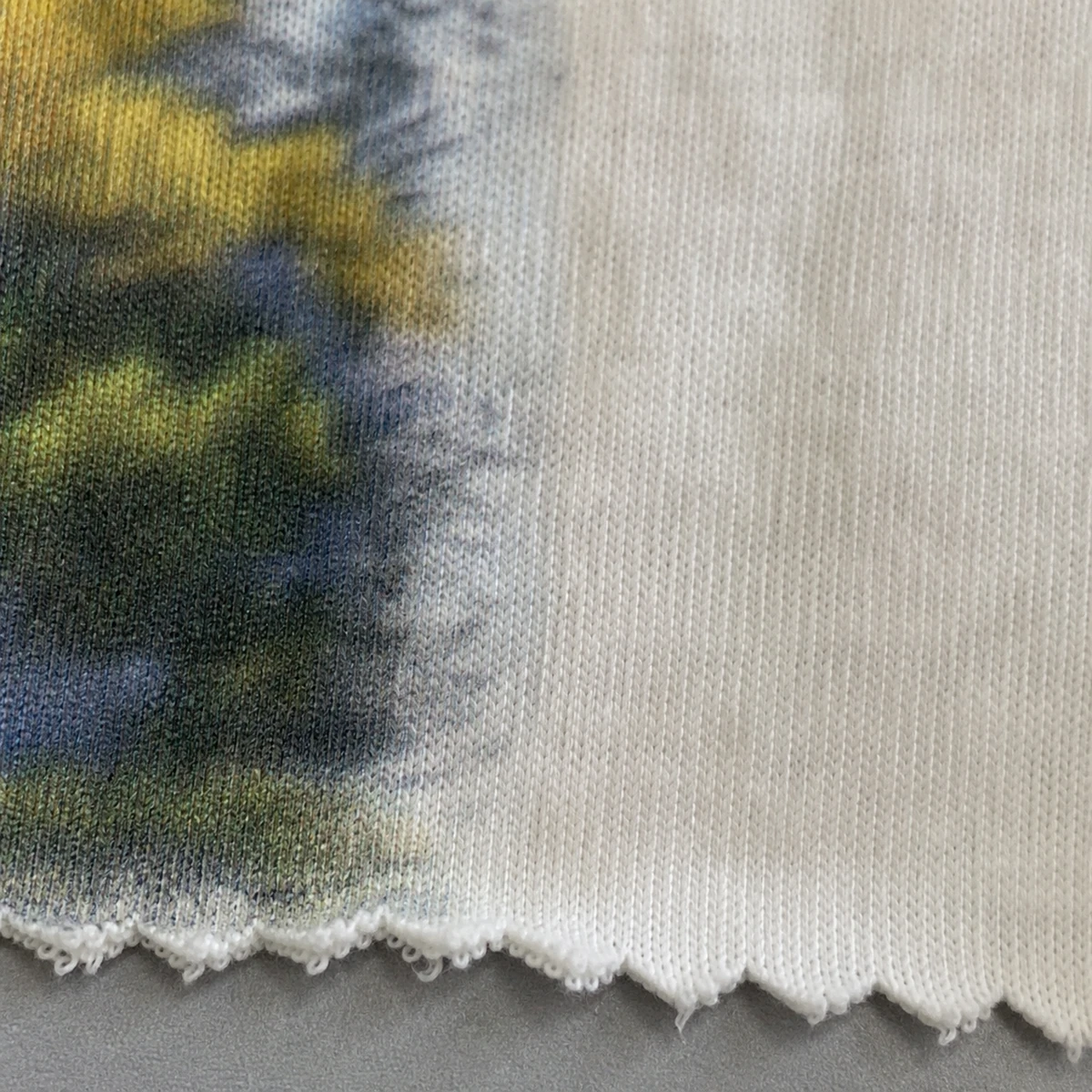Cotton jersey digital print sample showing fibre surface and edge detail