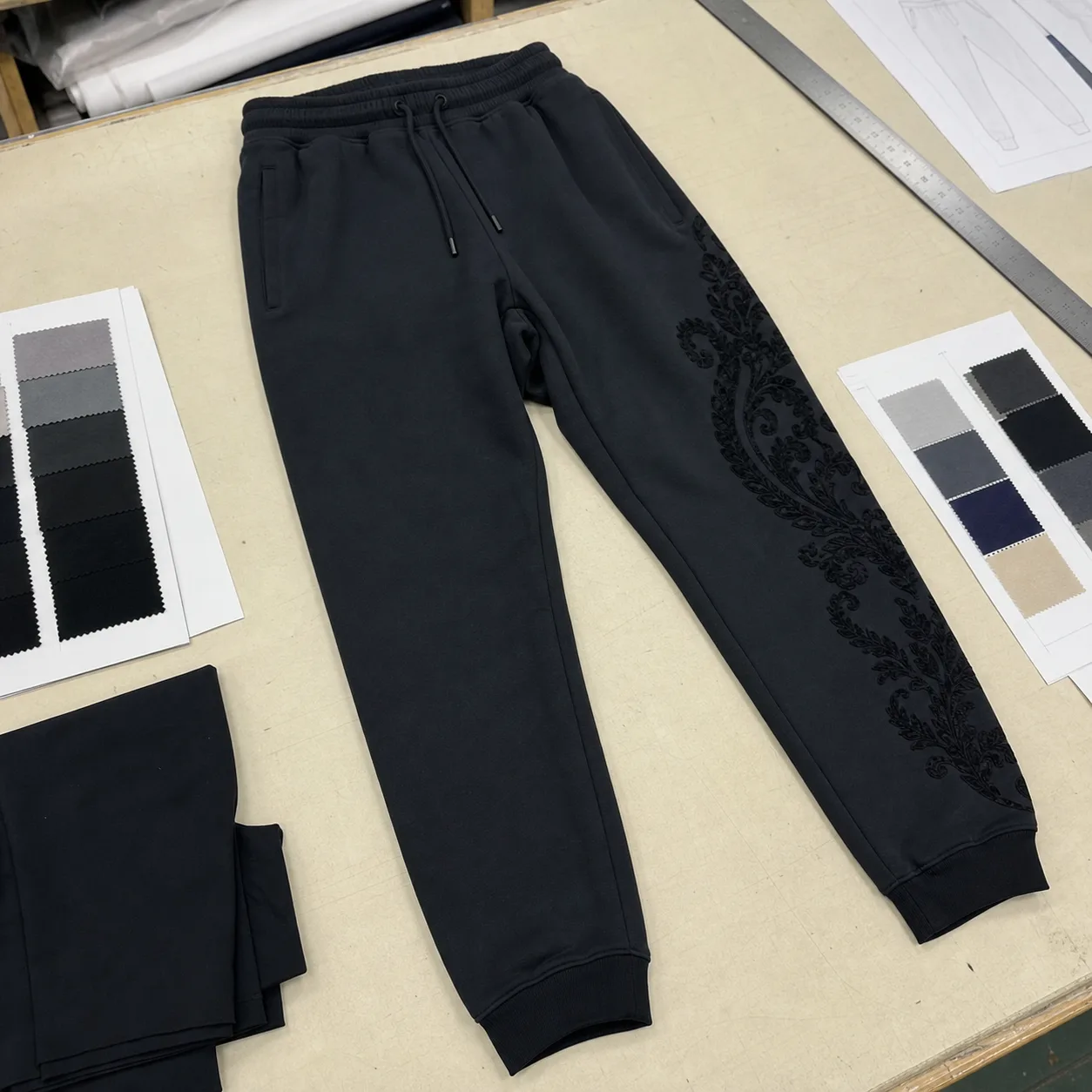Jogger direction with a flock graphic placed away from pocket and knee