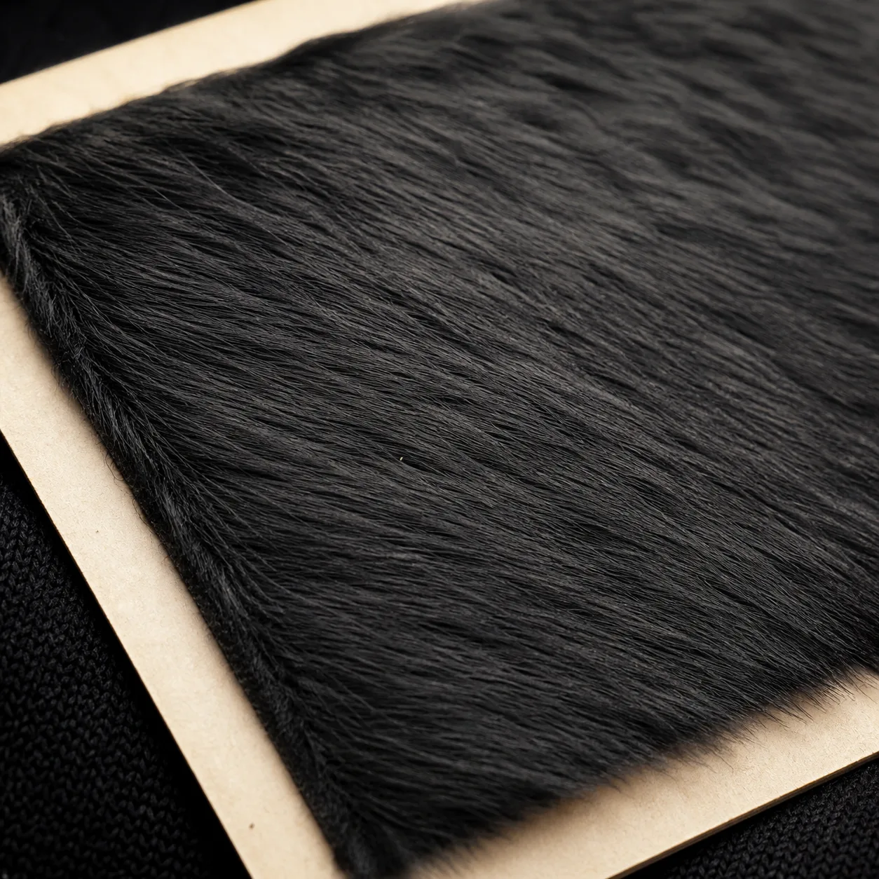 Longer fine flock fibres showing directional pile and fibre length