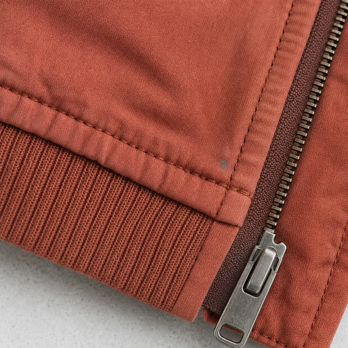 Component mismatch and staining on a garment-dyed style