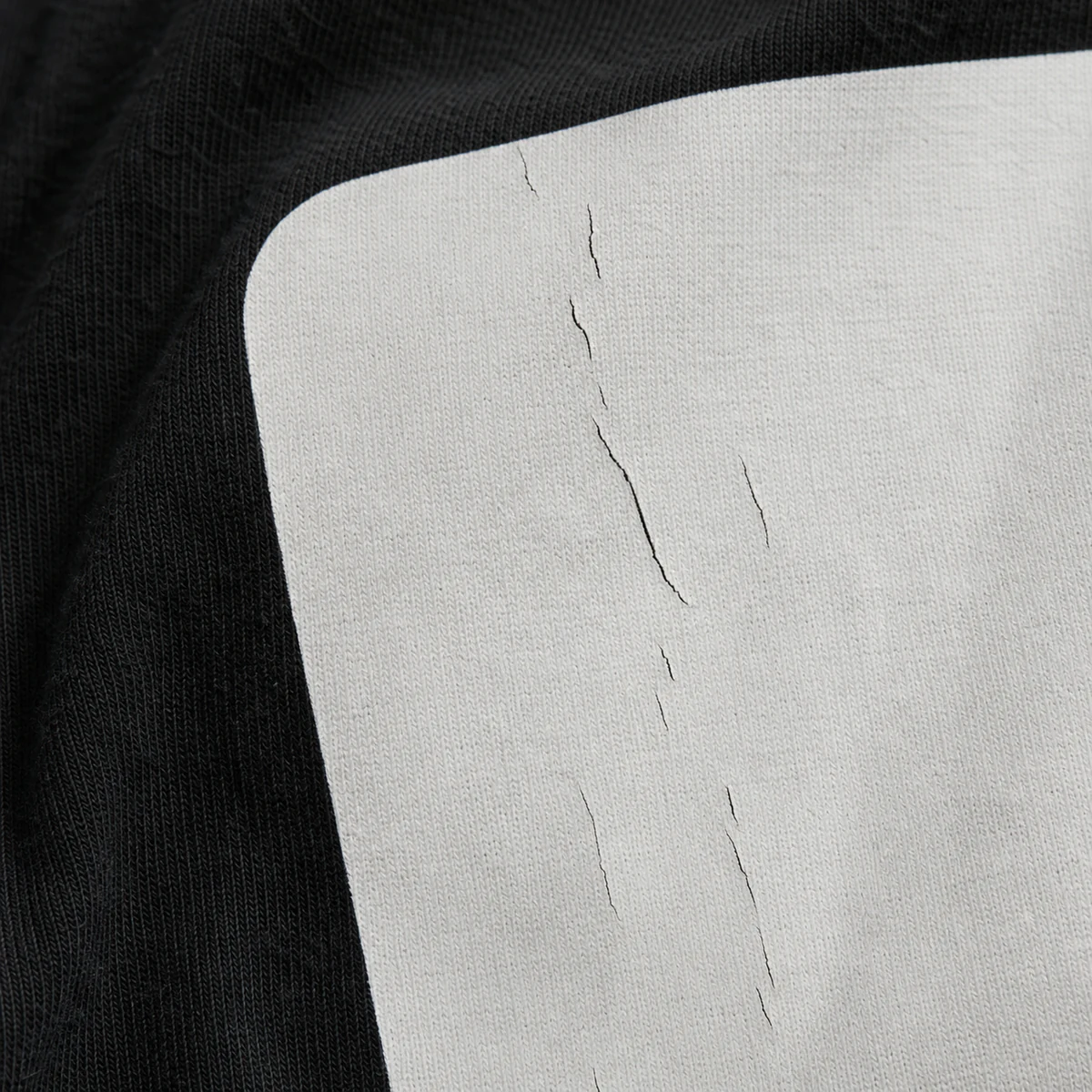 Screen-print ink cracking after an unsuitable wash or cure result