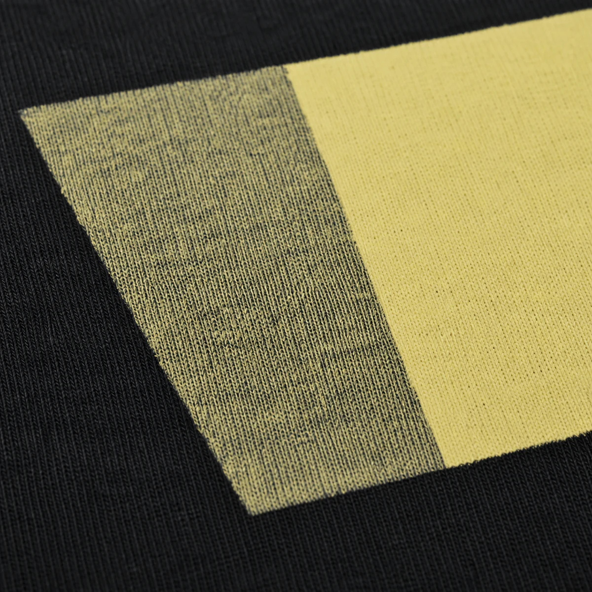 Dark fabric showing through a screen print with poor opacity