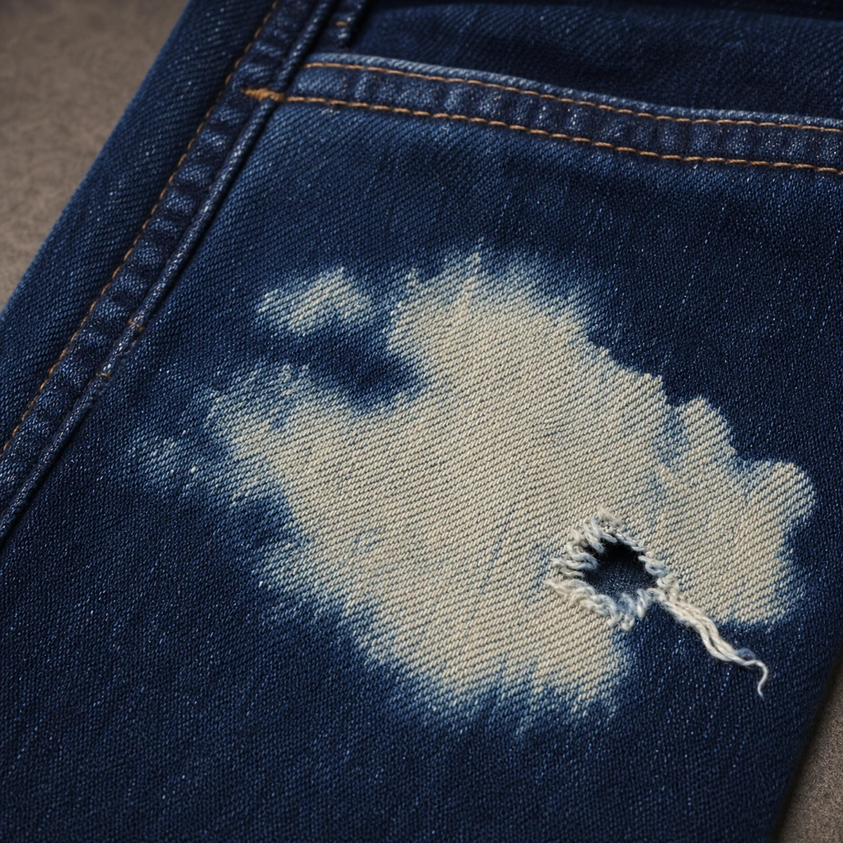 Over-discharged garment area crossing into fibre damage