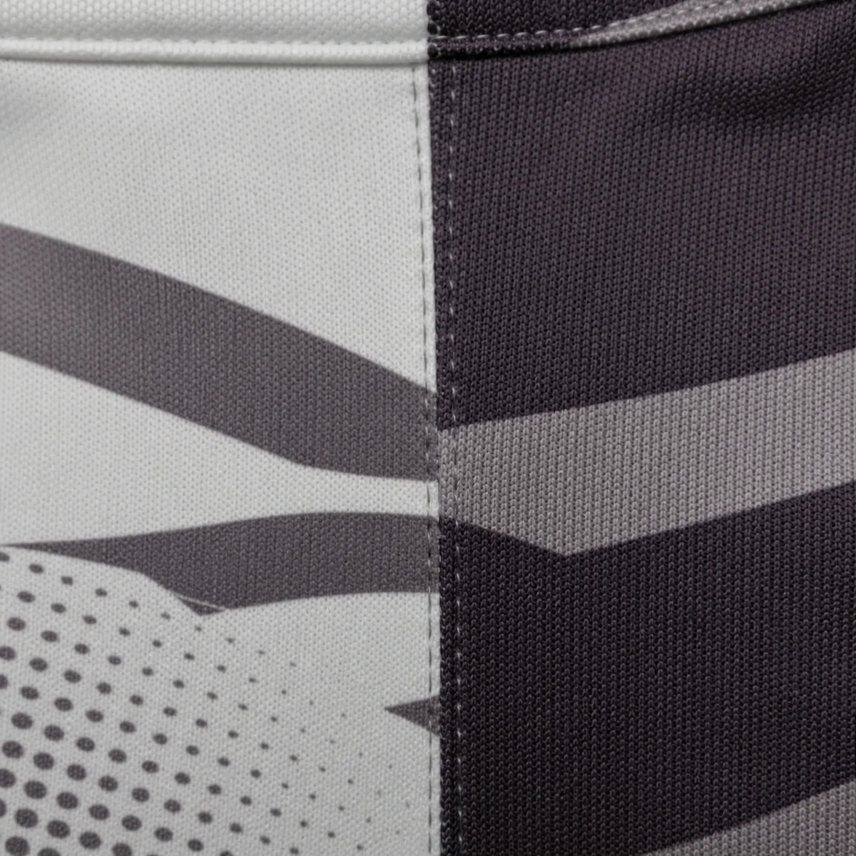 Sublimation artwork interrupted across a sewn panel join