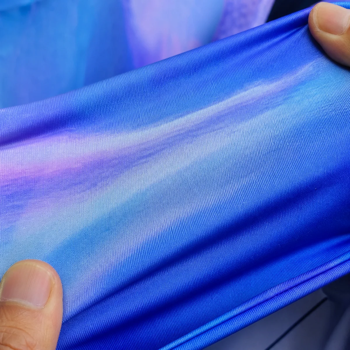 Sublimated stretch fabric showing colour loss under extension