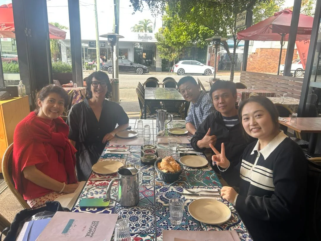 Canton Fashion team meeting clients at a restaurant