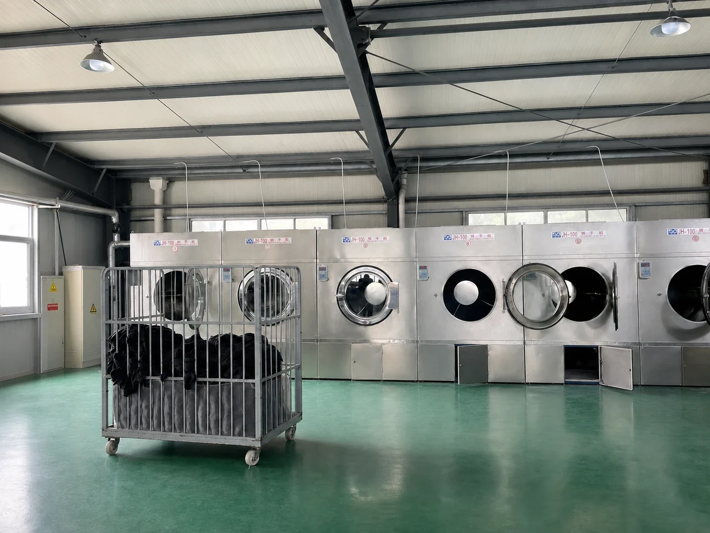Industrial garment washing and drying area at a partner factory
