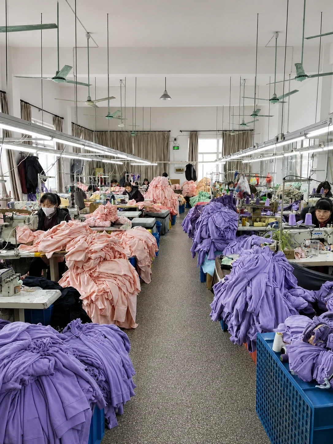 Main sewing workshop with garment bundles and operators