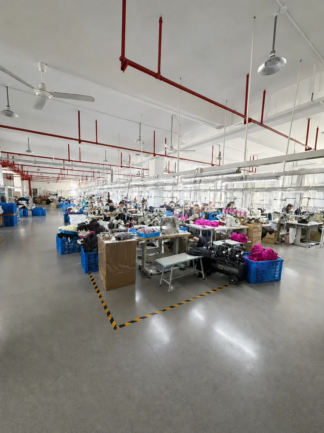 Wide view of a Chinese garment factory sewing floor